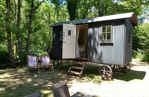 Busserolles Cabin | Romantic riverfront shepherds' hut with outdoor kitchen w/firepit