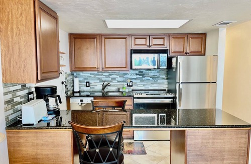 Vanderbilt Beach Condo | ROOFTOP POOL, BAY VIEW & STEPS TO VANDERBILT BEACH!