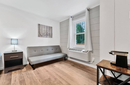 Houghton Lake Hotel | Room #4: Updated King Suite w/small couch