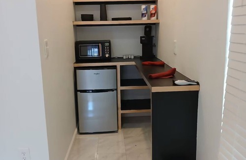 Norman Apartment | Rouge Room at Whispering Pines bed-and-breakfast