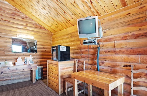 St. Charles Cabin | Rustic camping studio with large front porch & kitchenette