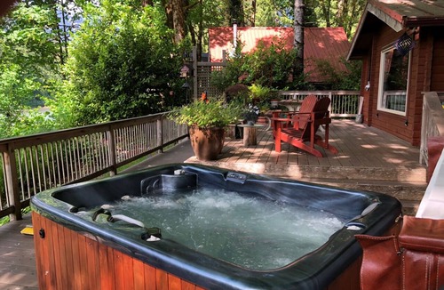 Gold Bar Cabin | Rustic Cedar Cabin on the River beneath Mt Index with intimate Hot Tub