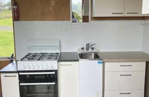 Pukekawa Cabin | Rustic Farm Cabin with 5 Star River Views