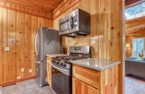 Zigzag House | Rustic lodge with private hot tub, fireplace & riverfront views - dog-friendly