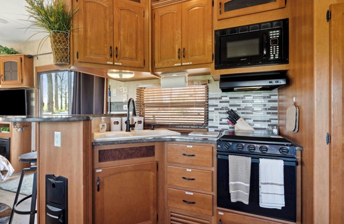 Langworthy RV Rental | Rustic Retreat Camper - on Silver Lake in Delhi. Pet Friendly!