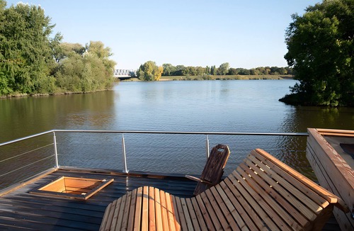Neuland Boat Rental | Rustic Tiny Houseboat with Rooftop Terrace and Fireplace