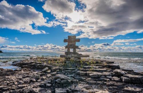 Lion's Head House | Rustic Waterfront Log Cabin