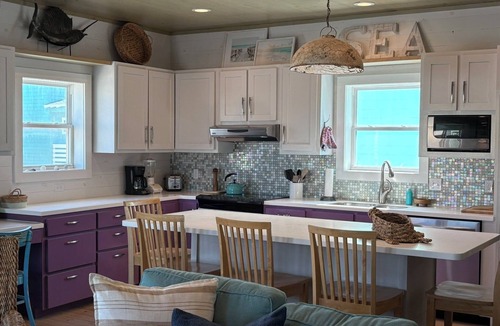 Sand Point House | SandPoint steps to beach,boardwalk,shared heated pool&hot tub,golf cart friendly