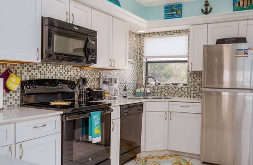 Holmes Beach Condo | Sandy Cheeks & Barefeet, Gorgeous interior Gulf beach Place, pool, on beach side