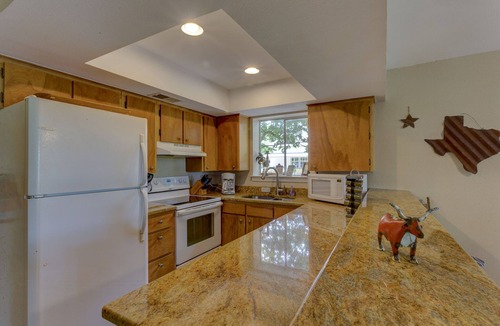 New Braunfels House | Scenic riverfront home on quiet stretch of Guadalupe - waterfall by front porch