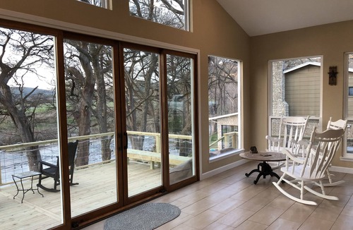 New Braunfels House | Scenic riverfront home on quiet stretch of Guadalupe - waterfall by front porch