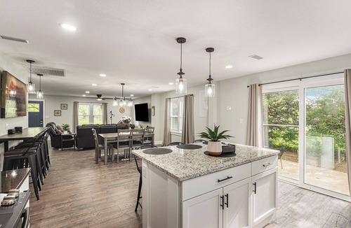 Grandview House | Secluded ½-acre retreat surrounded by trees for ultimate privacy and quiet. Remodeled and beautifully furnished with modern finishes. Enjoy a peaceful setting just 8 minutes from Belton/Raymore—perfect for relaxing stays or extended work trips.