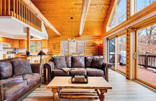Friendship House | Secluded, dog-friendly home with tree-lined view, firepit, fireplace, & deck