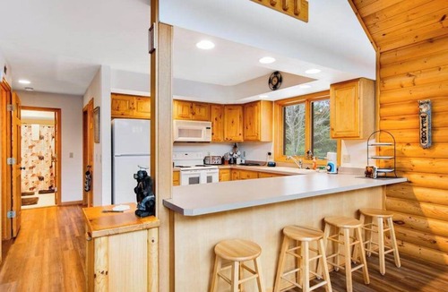 Friendship House | Secluded, dog-friendly home with tree-lined view, firepit, fireplace, & deck