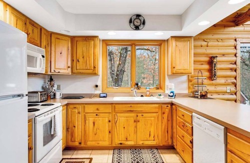 Friendship House | Secluded, dog-friendly home with tree-lined view, firepit, fireplace, & deck