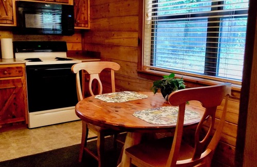 Eureka Springs Cabin | Secluded Hideaway Cabin boasting Wrap-Around Deck and Jacuzzi for two! Trail & Cave on property!