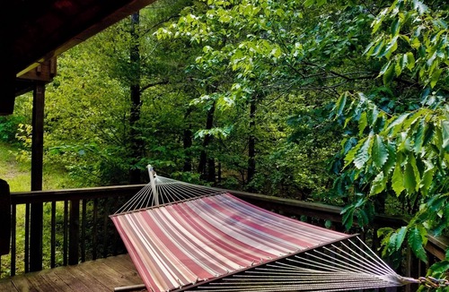 Eureka Springs Cabin | Secluded Hideaway Cabin boasting Wrap-Around Deck and Jacuzzi for two! Trail & Cave on property!