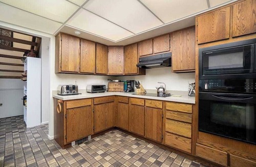 Maple City House | Secluded home with three kitchens, vaulted ceilings, washer/dryer, & patios