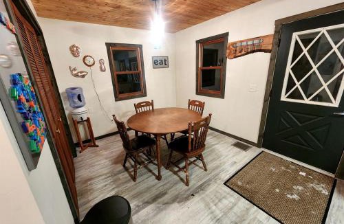 Paris House | Secluded Luxury Cabin with Hot Tub on 10 Private Acres near Trails in Reed City, Michigan