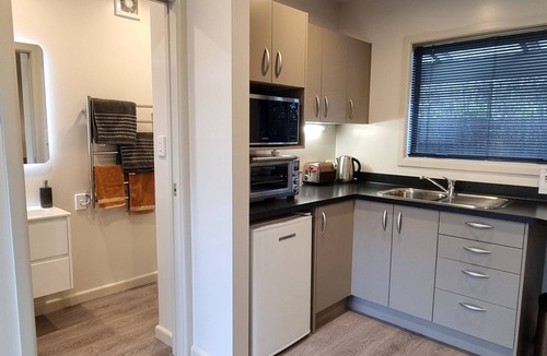 Clive Cottage | Secluded Riverside Cottage set in native garden.