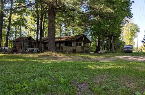Dickson Township House | Secluded Rustic Cabin Rental Inside Manistee National Forest in Brethren, Michigan