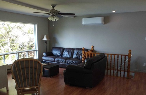 Notre-Dame-de-Pontmain Cottage | Serene waterfront 4 bdrm/2 bath cottage with wifi/hot tub/deck/bbq/firepit/dock