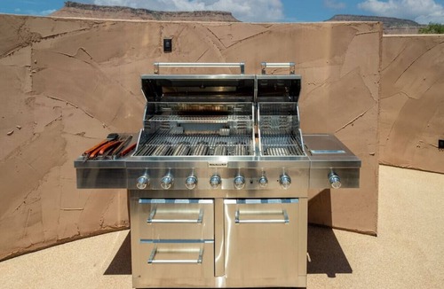 Virgin RV Rental | Serene Cliff Dwelling - King Bed, Hot Tub, and BBQ