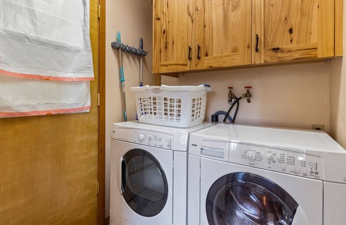 Hope House | Serene lake-view retreat with deck, grill, firepit, & fireplace