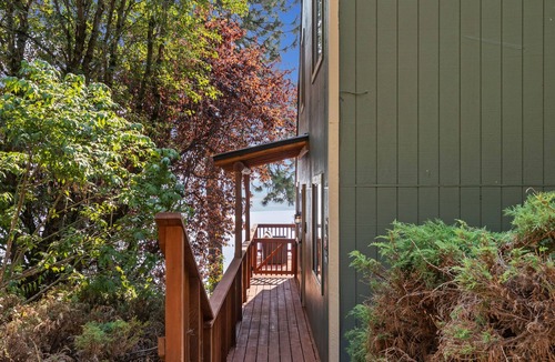 Hope House | Serene lake-view retreat with deck, grill, firepit, & fireplace