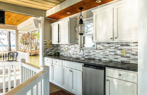 Henrico House | Serene Lakefront Escape with Sunset Views, Private Boathouse, and Endless Fun!