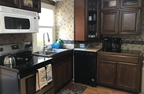 Wolcott Cottage | Serene Port Bay Cottage: waterfront, 3 kayaks, pedal boat, fire pit, grill, ac