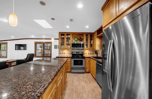 Kingsland House | Serene Riverfront Sanctuary: Private Boat Dock and Hill Country Views