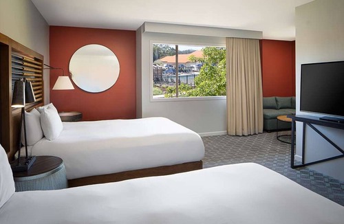 Live Oak Hotel | Serenity Now: Your Santa Cruz Retreat with Deck, Pool & Fireside Relaxation