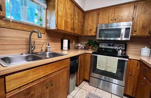 Buchanan Dam House | Shaded riverfront getaway. Dog friendly