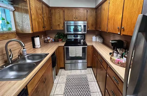 Buchanan Dam House | Shaded riverfront getaway. Dog friendly