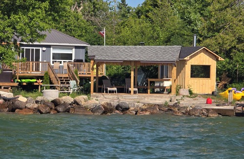 Brechin Cottage | Shallow Sandy Lakefront Cottage - Hot Tub, Sauna & Tiki Hut