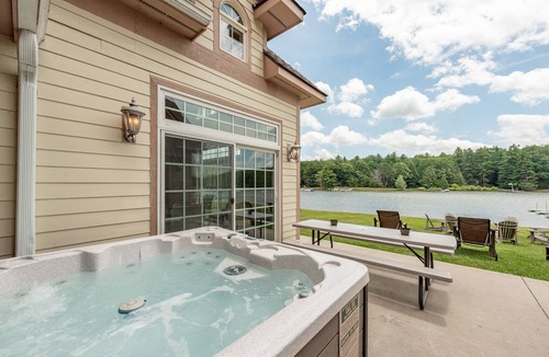 Waterfront Greens House | Signature Lakefront Home w/Pool & Views