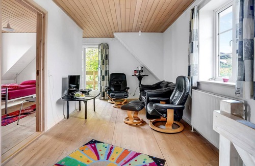 Henne Apartment | Situated right next to the train station, this vacation home near Henne St. awaits you.