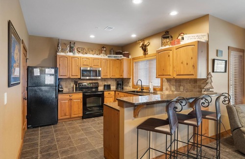 Boyne Falls Condo | Ski-In/Ski-Out Creekside Condo with Private Hot Tub at Boyne Mountain