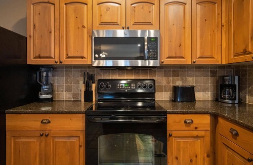 Boyne Falls Condo | Ski-In/Ski-Out Creekside Condo with Private Hot Tub at Boyne Mountain