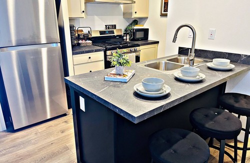 Carmichael House | Sleek+Serene ADU - Modern Kitchen Outdoor Vibes