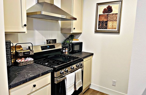 Carmichael House | Sleek+Serene ADU - Modern Kitchen Outdoor Vibes