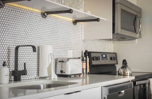Sobro Cottage | Sleeps 8 4 Sobro Suites w/Kitchens & Modern Touches by Avantstay