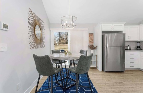 Claycomo House | Sleeps 8 Near Arrowhead 4BR Pets Ok