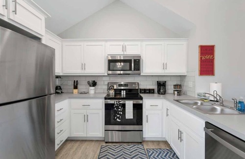 Claycomo House | Sleeps 8 Near Arrowhead 4BR Pets Ok