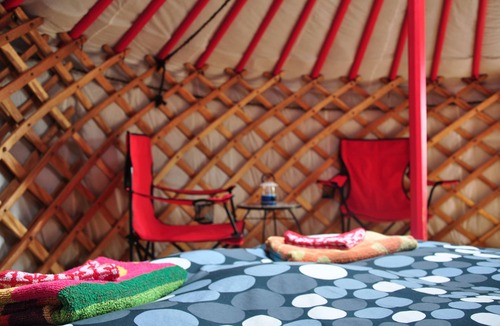 Indian Brook Resort | Small red yurt at Cabot Shores Wilderness Resort