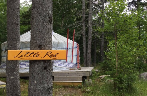 Indian Brook Resort | Small red yurt at Cabot Shores Wilderness Resort