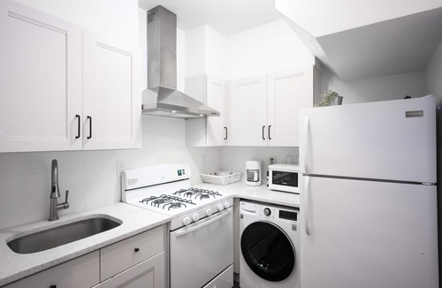 East Flushing House | Smart Home with Skylight! 1500 sqft Deck!