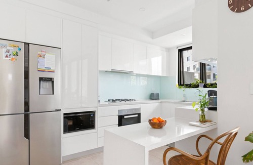 Homebush Apartment | Spacious 2-Bed: Rooftop Views, Near Olympic Park