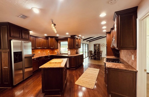Biggar House | Spacious 4-bedroom house with heated pool great for large groups.